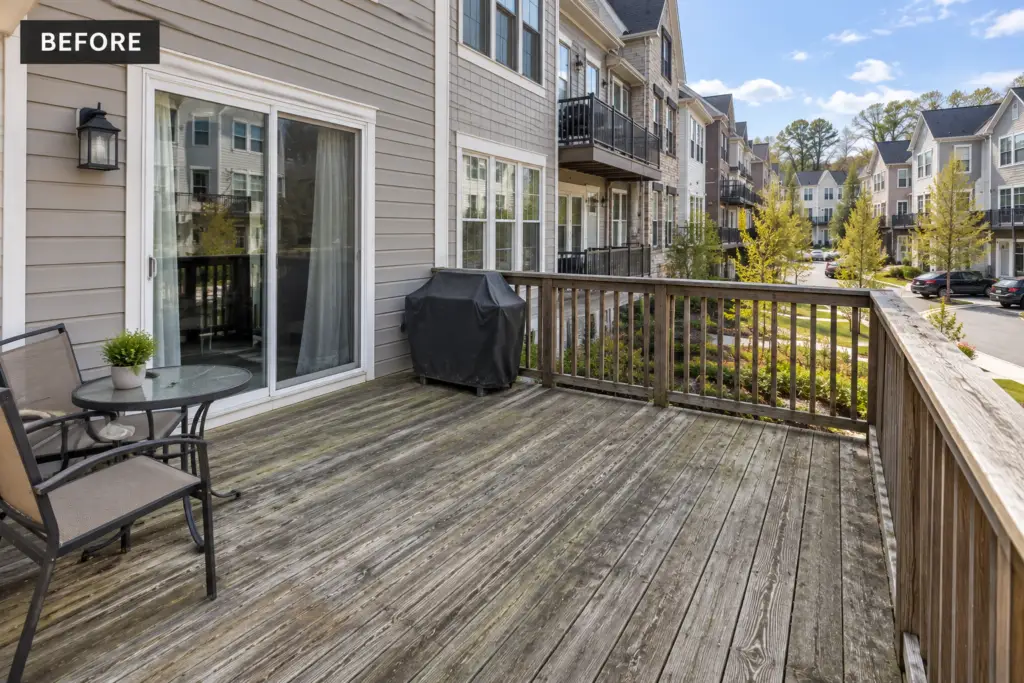 Before composite deck builder project in Clarksburg, MD showing a weathered wood townhouse deck