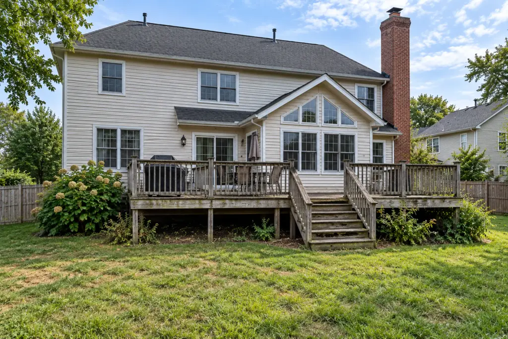 Before composite deck builder project in Germantown, MD showing a weathered wooden deck
