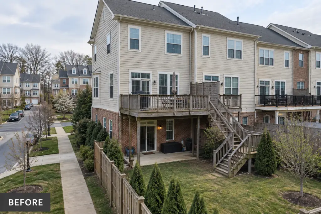 Before composite deck builder project in Redland, MD showing an aging wood deck on a townhouse