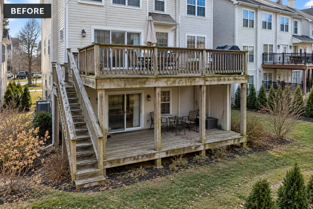 Before composite deck builder project in Olney, MD showing a weathered two-story wood deck and neighboring townhomes
